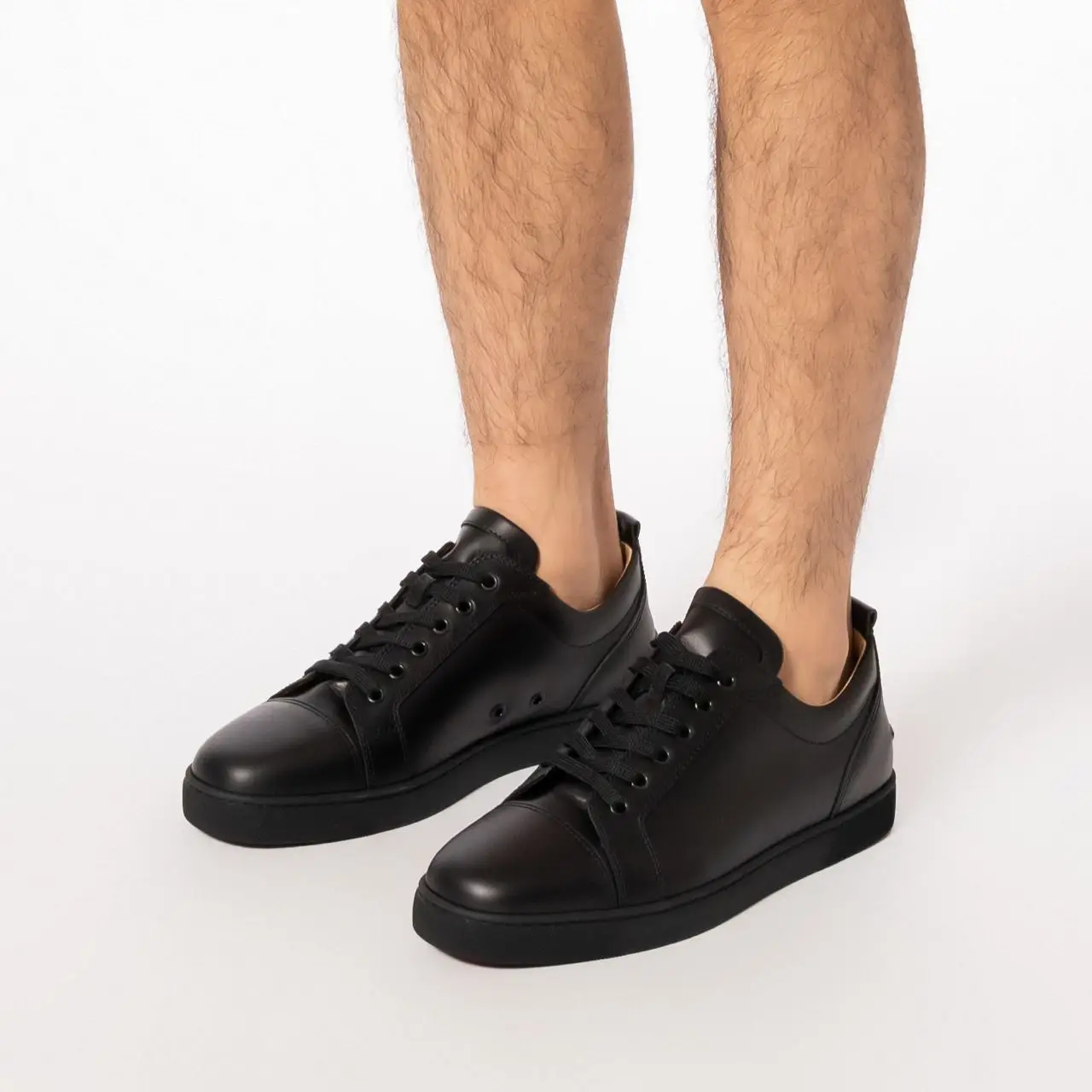 All black shops louboutin sneakers