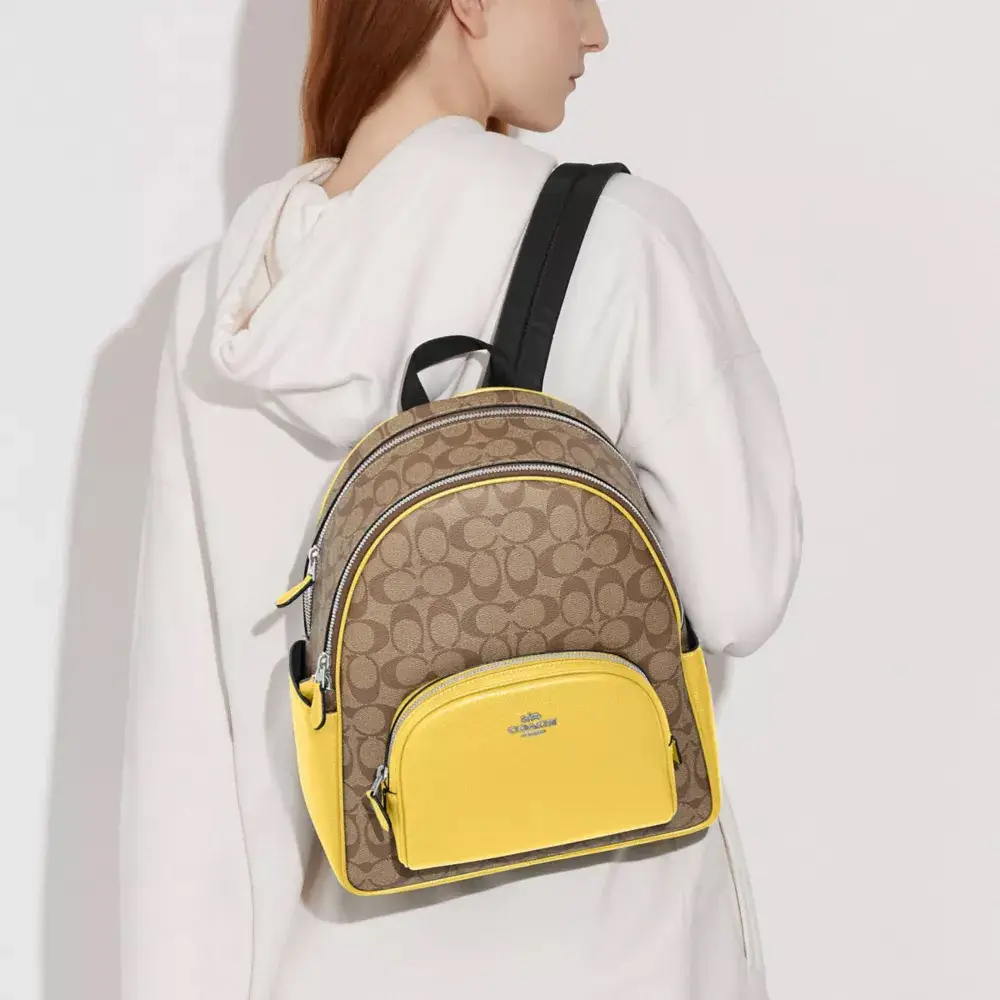 coach court backpack in signature canvas Outlet Large Signature coated canvas and refined pebble leather Inside zip and multifunction pockets Double zip closure fabric lining Handle with 2 1/4 drop Outside zip pocket Adjustable shoulder straps 10 3/4 (L) x 12 1/2 (H) x 4 3/4 (W) Style No. Signature Canvas Gold Coach Backpack
