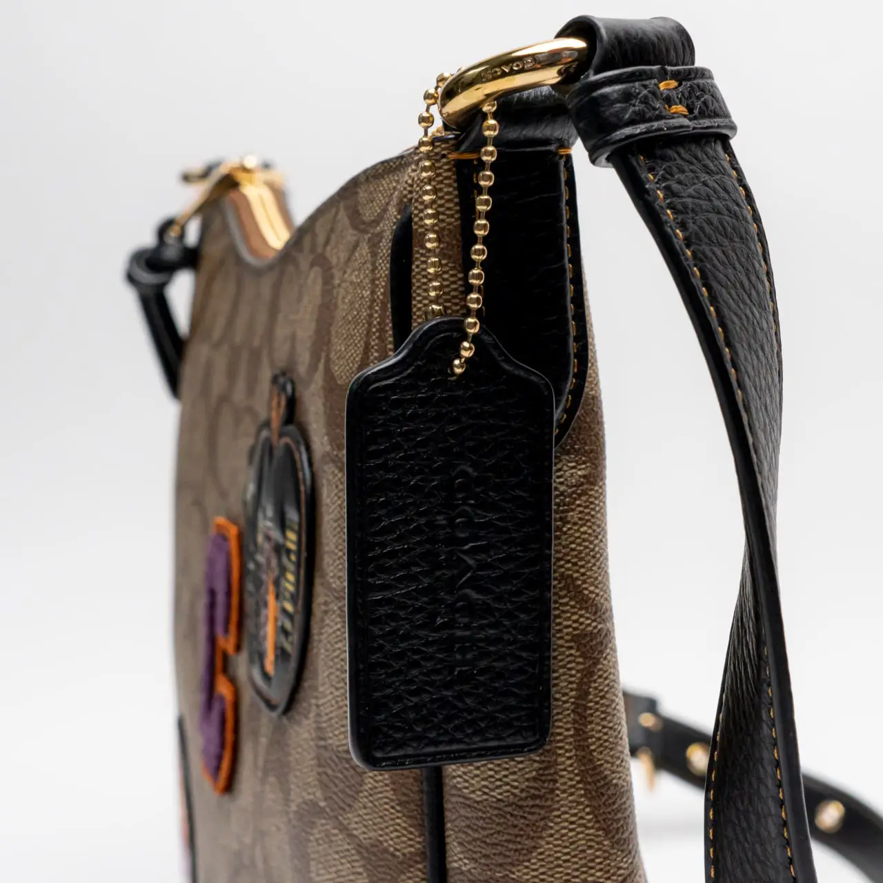 Coach Ellie File Bag in Signature Canvas with Disco Patches  COACH ELLIE FILE Sig CC with Patches Messenger Crossbody Bag In KHAKI MULTI main image 0