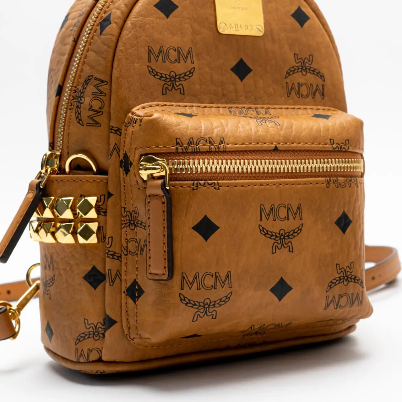 bebe boo backpack x-mini ราคา MCM X-Mini Stark Bebe Boo Side Studs Backpack in Visetos Cognac – voilà.id
