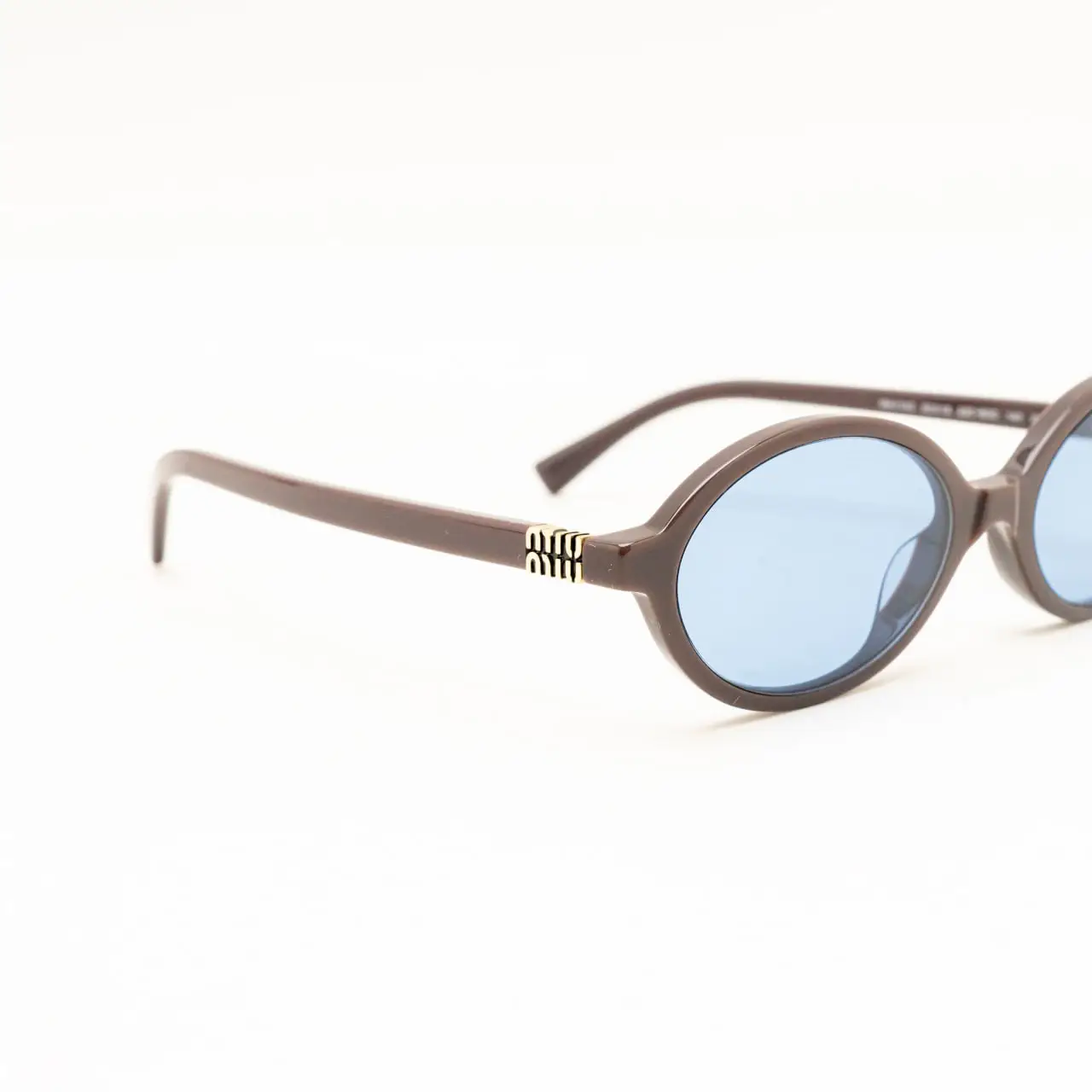 Miu Miu MU04ZS 22C60O Sunglasses Moka Oval Frame, Light Blue Lenses Miu Miu 04ZS 22C60O main image 2