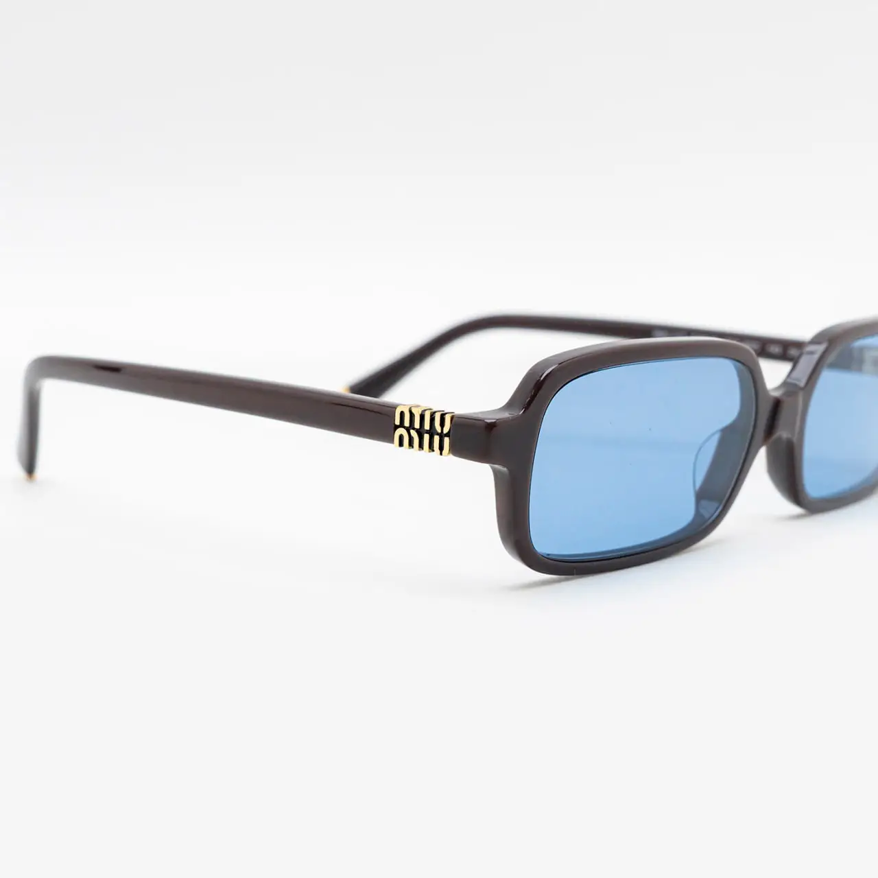Miu Miu MUA06S 22C60O Sunglasses Moka Rectangle Frame, Light Blue Lenses MU 04ZS Miu Miu Sunglasses 22C60O Moka - eye-oo.com main image 3