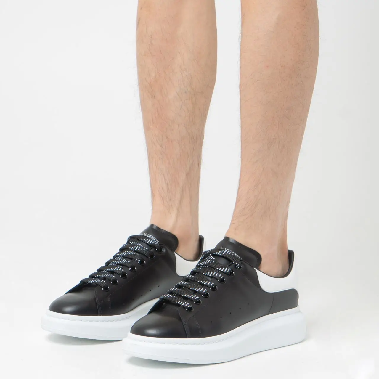 Alexander mcqueen trainers black and white online