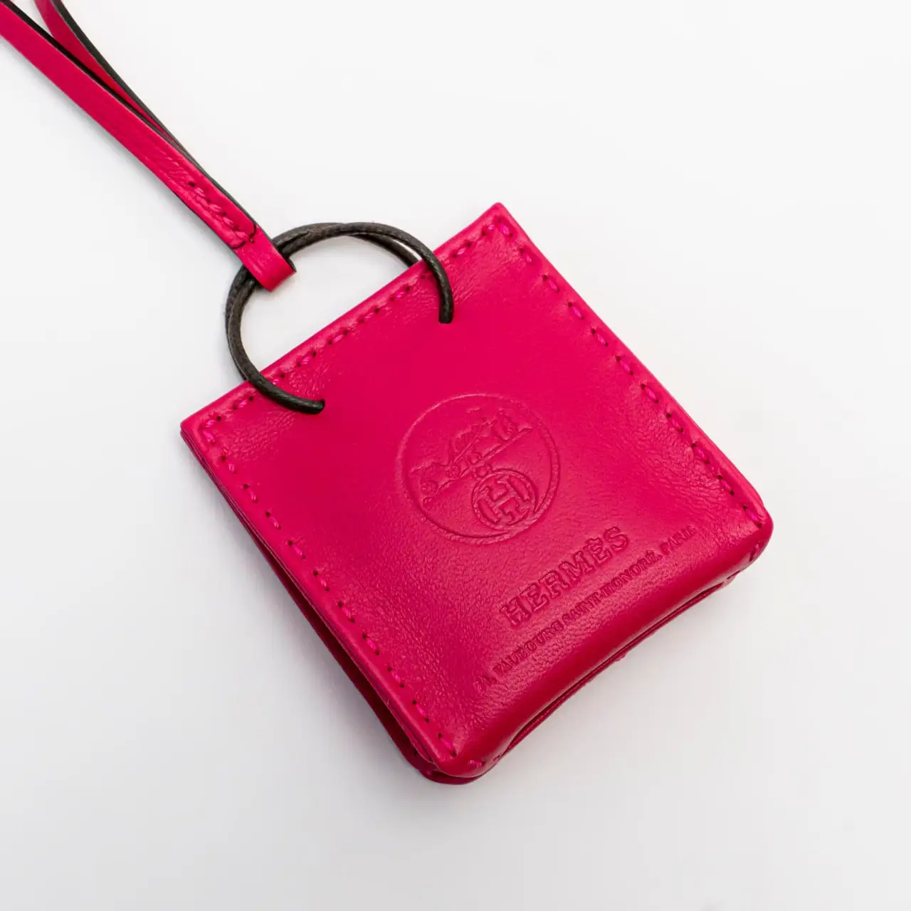 Hermes orange bag charm hotsell