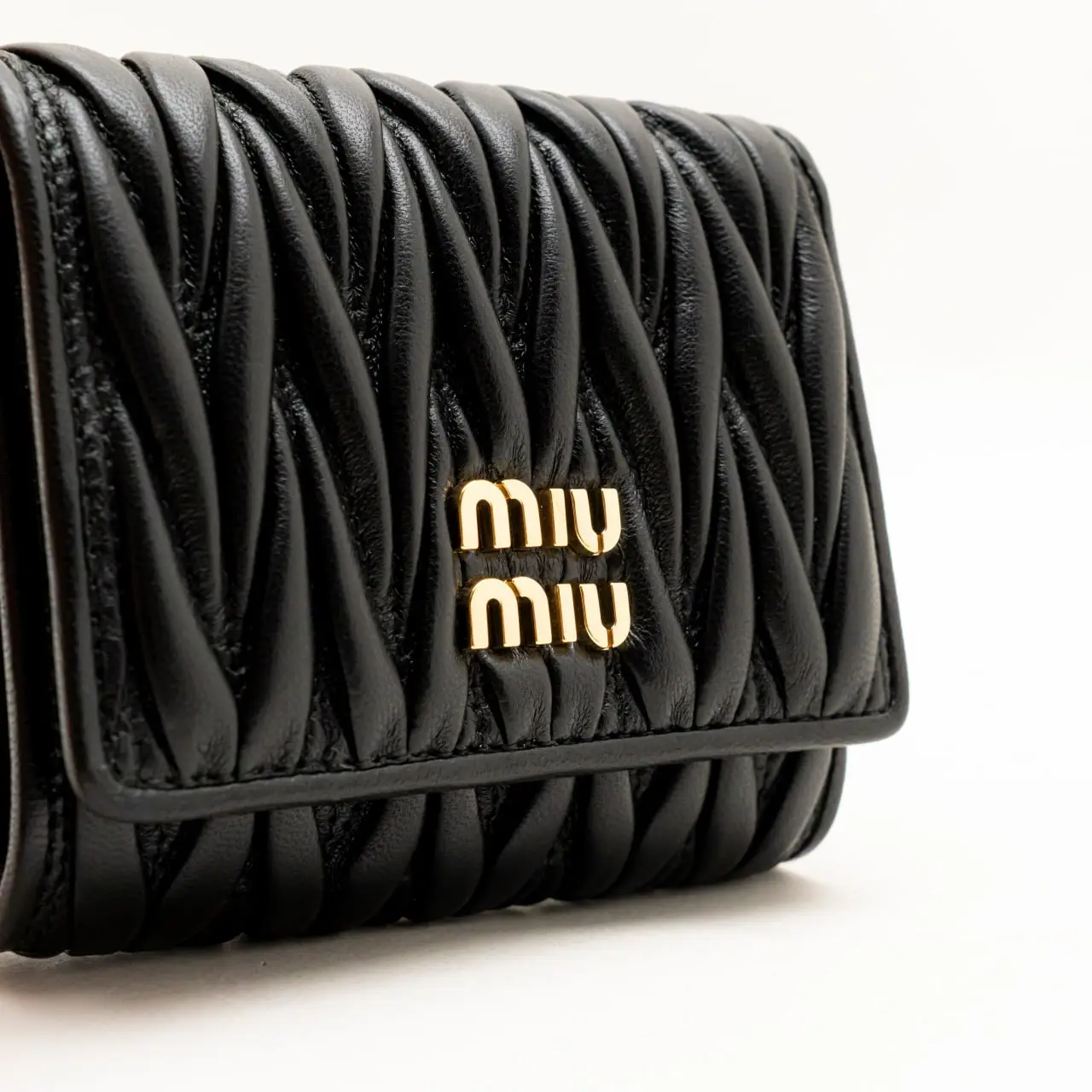 Miu Miu Small Matelassé Nappa Leather Trifold Wallet Black – voilà.id