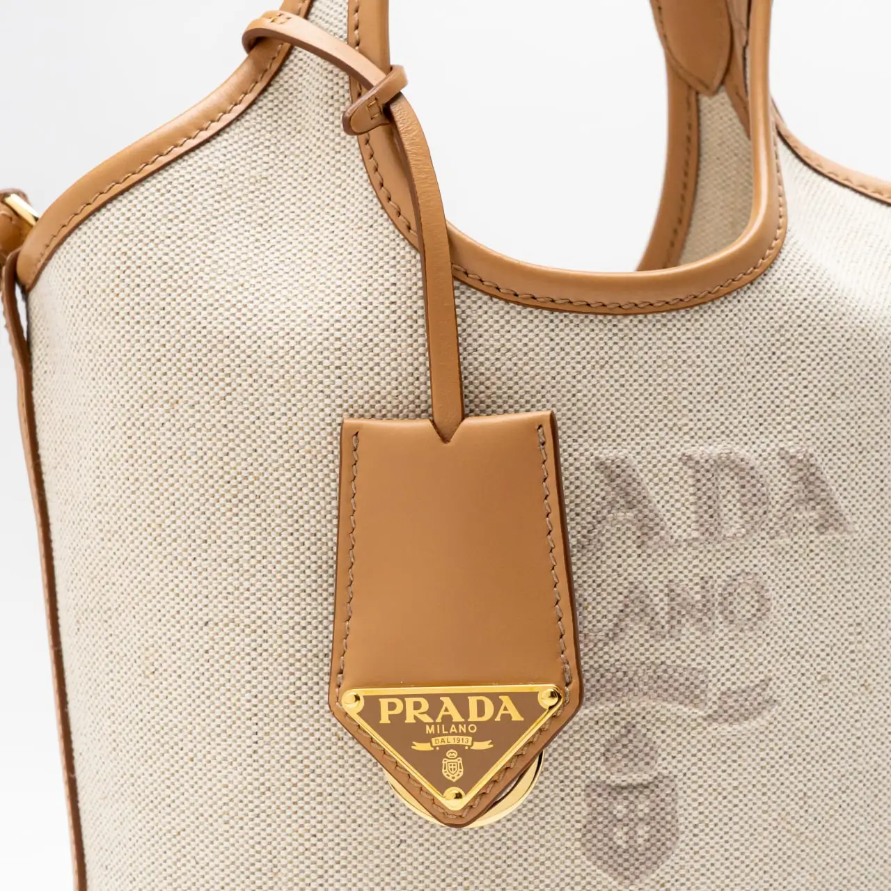 国内発 PRADA Linen blend and leather mini-buckle bag 人気 Prada Logo Embossed Linen Blend Leather Mini-Buckle Bag
