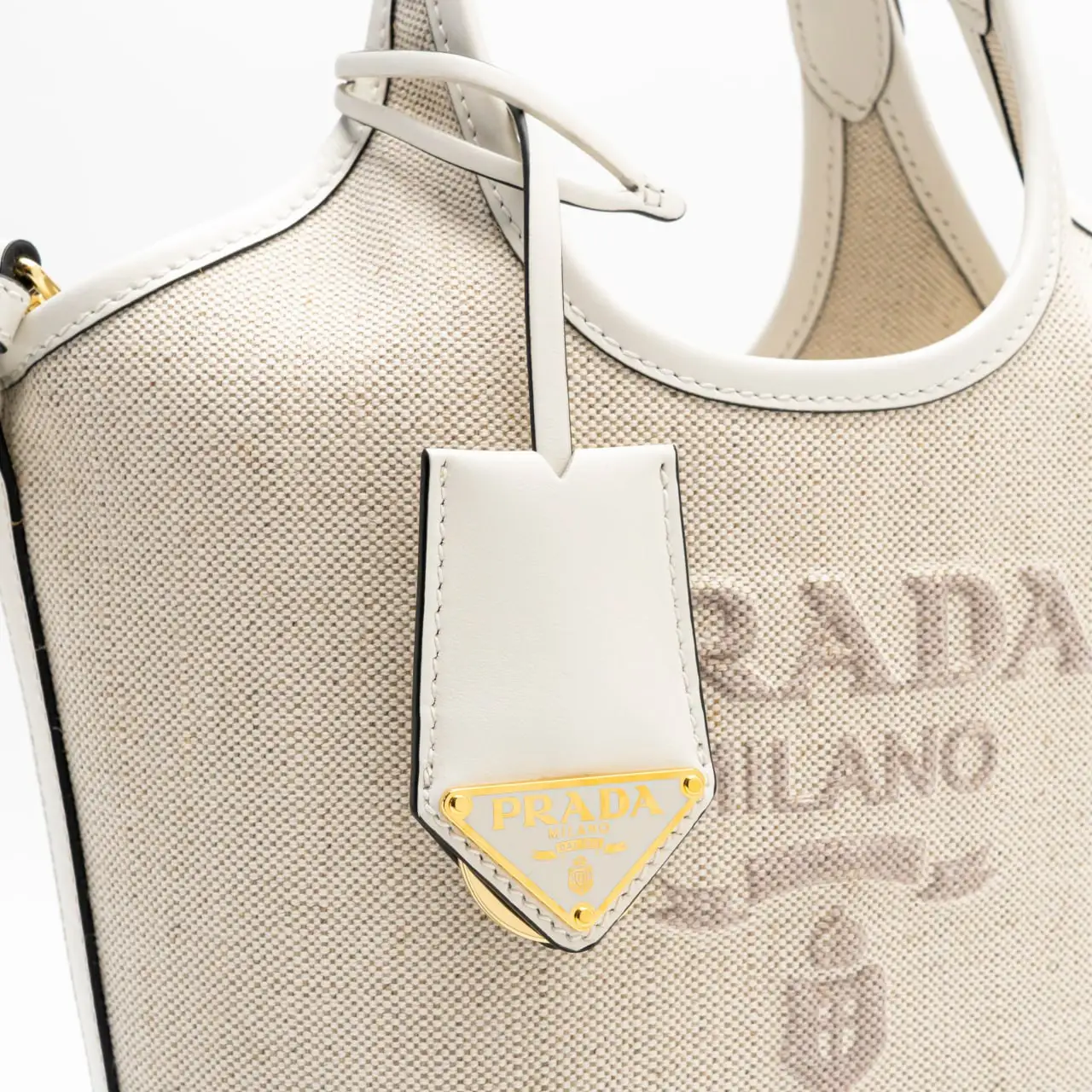 Prada Logo Embossed Linen Blend Leather Mini-Buckle Bag