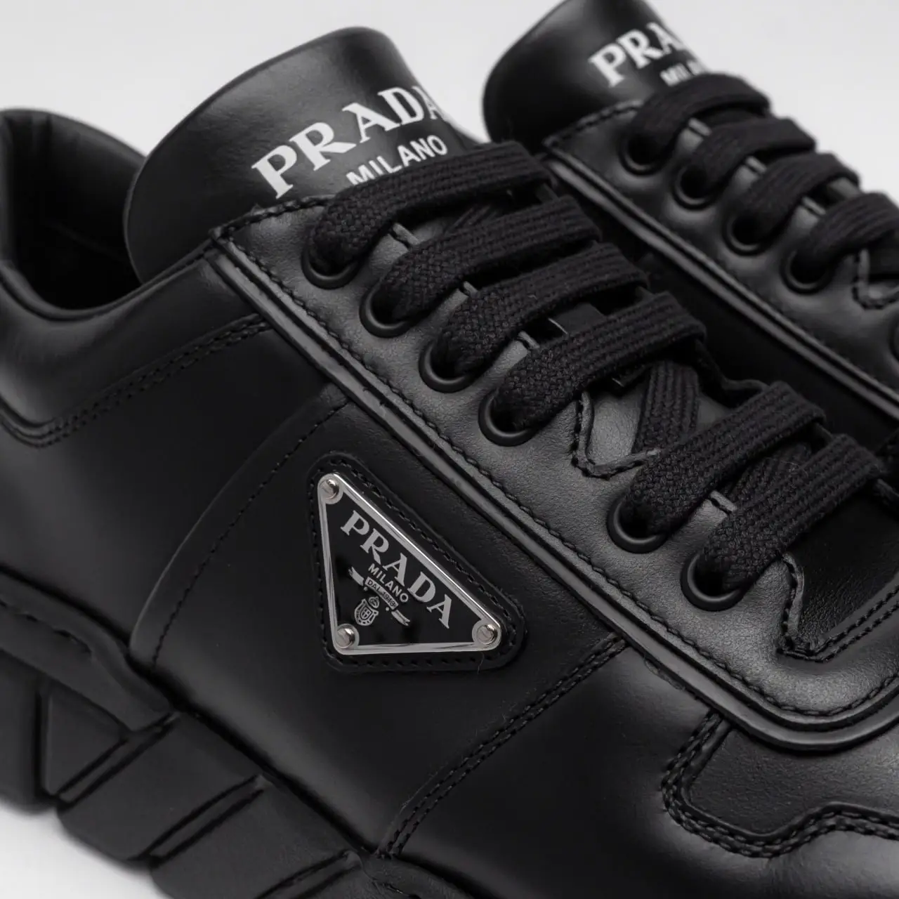 Prada Leather Sneakers with Triangle Metal Logo All Black Prada Leather Sneakers with Triangle Metal Logo All Black