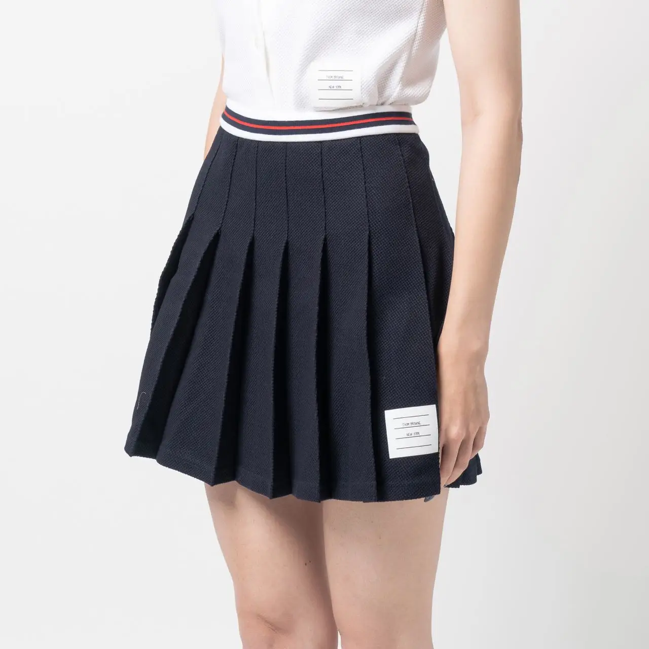 Thom Browne Pleated Textured Cotton Short Skirt Navy – voilà.id